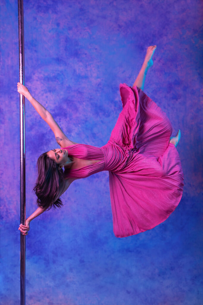 posed pole dancer photo, in the air, long pink dress